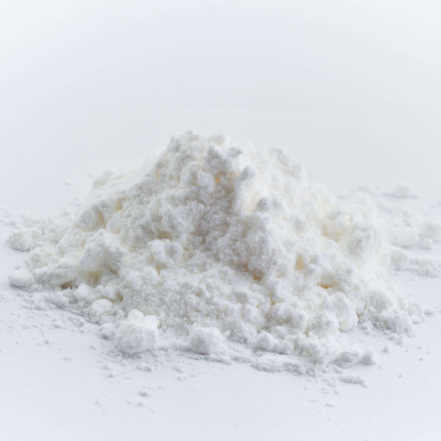 Gold Tree Organics CBD isolate powder pile on white background showing fine pure THC free powder