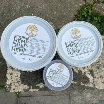 Three sizes of Gold Tree Organics equine hemp pellets in white containers for horse health